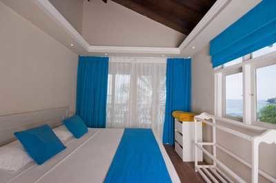 maldivi_chaaya_island_garden_bungalow_postelja